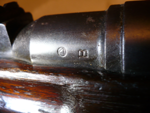 Japanese Arisaka Type 38 rifle showing B on the barrel as a proof mark symbol.